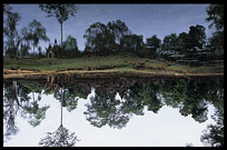 Banteay Srei reflected in a small pond. Siem Riep, Angkor, Cambodia