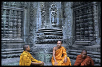 Resting monks inside Ta Phrom. Siem Riep, Angkor, Cambodia