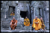 Resting monks inside the Bayon, Angkor Thom. Siem Riep, Angkor, Cambodia