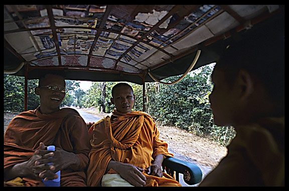 Monks inside a remorque-moto.