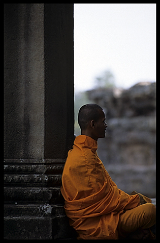 A resting monk inside Angkor Wat.