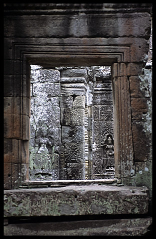 Looking through a window inside Banteay Kdei.