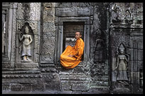 A monk at Ta Phrom. Siem Riep, Angkor, Cambodia