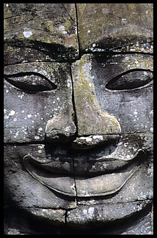 Close up of one of the many smiling faces in the Bayon, Angkor Thom.