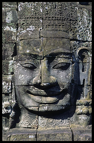 Close up of one of the many smiling faces in the Bayon, Angkor Thom.