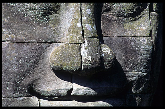 Close up of one of the many smiling faces in the Bayon, Angkor Thom.