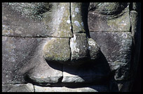 Close up of one of the many smiling faces in the Bayon, Angkor Thom. Siem Riep, Angkor, Cambodia