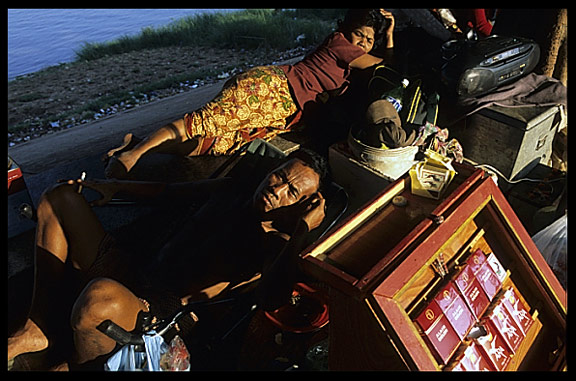 A local salesman at Phnom Penh's riverfront.