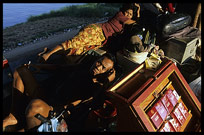 A local salesman at Phnom Penh's riverfront.