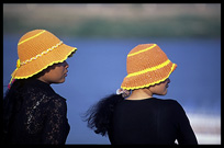 Two Cambodian girls are enjoying the view of the Mekong at Phnom Penh's riverfront.