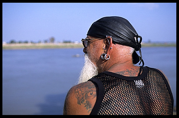 An English tourist is enjoying the view of the Mekong at Phnom Penh's riverfront.