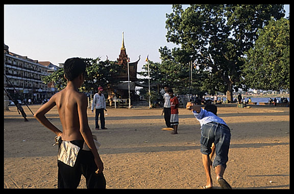 Cambodian children are playing a gambling game with flip flops, Phnom Penh.