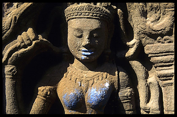 The blue breasts and lips of a Theravada statue at Wat Nokor, near Kompong Cham.