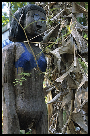 Tompuon cemetery with wooden statues resembling the deceased in the forest of Kachon, Cambodia