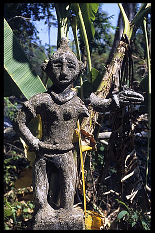 Tompuon cemetery with wooden statues resembling the deceased in the forest of Kachon, Cambodia