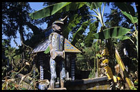 Tompuon cemetery with wooden statues resembling the deceased in the forest. Kachon, Ratanakiri, Cambodia