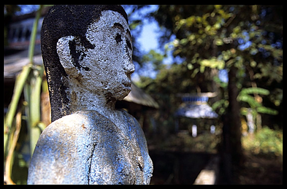 Tompuon cemetery with wooden statues resembling the deceased in the forest of Kachon, Cambodia