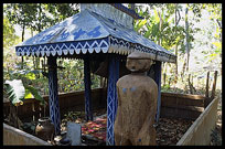 Tompuon cemetery with wooden statues resembling the deceased in the forest. Kachon, Ratanakiri, Cambodia