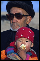 Portrait of Uyghur man with his daughter. Kashgar, Xinjiang, China