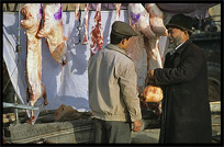 Portrait of Uyghur man selling meat. Kashgar, Xinjiang, China