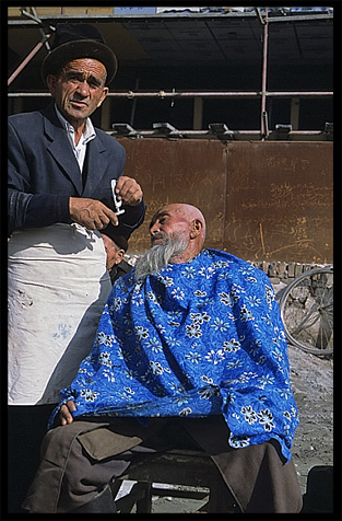 Portrait of Uyghur barber. Kashgar, Xinjiang, China