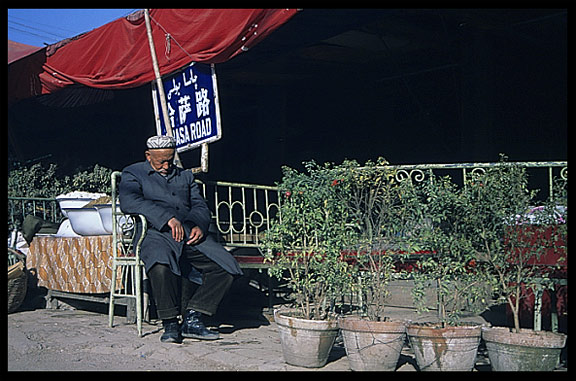 Portrait of Uyghur man taking a break. Kashgar, Xinjiang, China