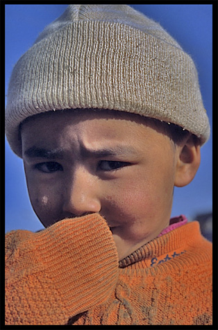 Portrait of Uyghur boy. Hotan, Xinjiang, China