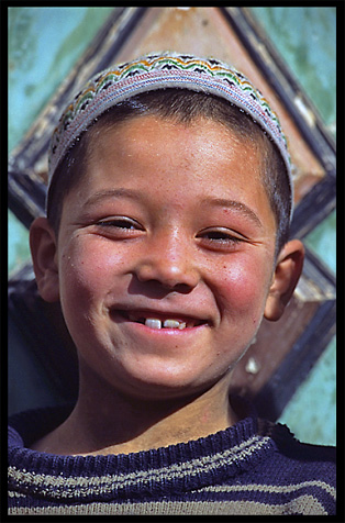 Portrait of Uyghur boy. Hotan, Xinjiang, China