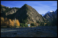 Heaven Pool or Heavenly Lake (Tian Chi) with snow-covered Tian Shan mountains in the distance. Urumqi, Xinjiang, China