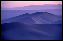 Towering sand dunes at Crescent Moon Lake (Yueyaquan). Dunhuang, Gansu, China