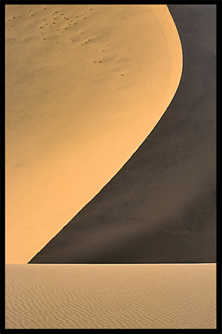 Towering sand dunes at Crescent Moon Lake (Yueyaquan). Dunhuang, Gansu, China