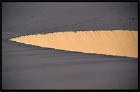 Towering sand dunes at Crescent Moon Lake (Yueyaquan). Dunhuang, Gansu, China