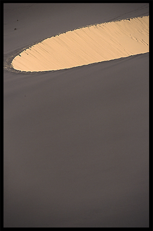 Towering sand dunes at Crescent Moon Lake (Yueyaquan). Dunhuang, Gansu, China