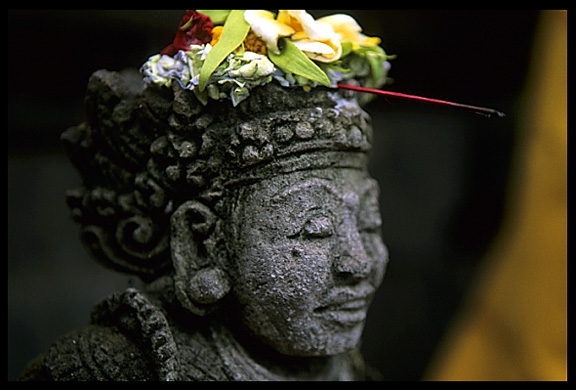 A familiar view: colourfull decorated statue in Candi Dasa.