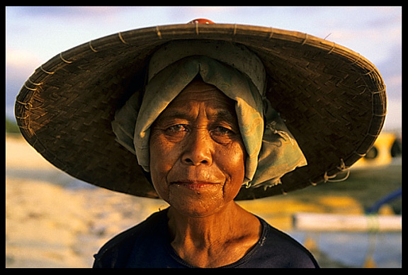 A local Gili lady strolling the beaches at low tide on Gili Meno.