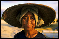 A local Gili lady strolling the beaches at low tide on Gili Meno.