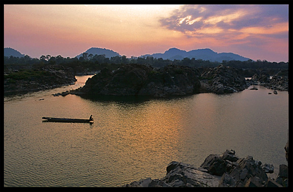 Sunset, overlooking the Cambodian mountains, on the four thousand islands. Si Phan Don, Don Khon, Laos