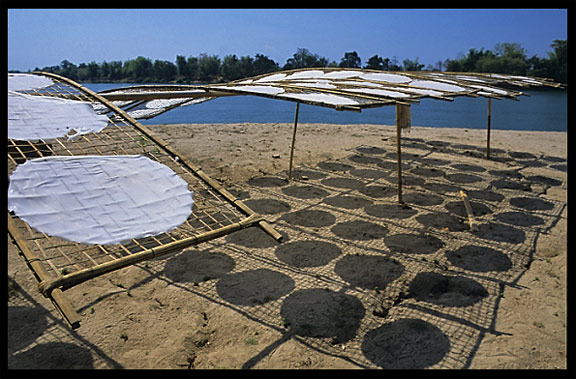 Drying Lao-style pancakes on the four thousand islands. Si Phan Don, Don Khong, Laos