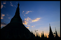 Silhouettes of the golden dome, big stupa,  and all the shrines, pavilions, images and bells at Shwedagon Paya in Yangon.