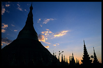 Silhouettes of the golden dome, big stupa, and all the shrines, pavilions, images and bells at Shwedagon Paya in Yangon.