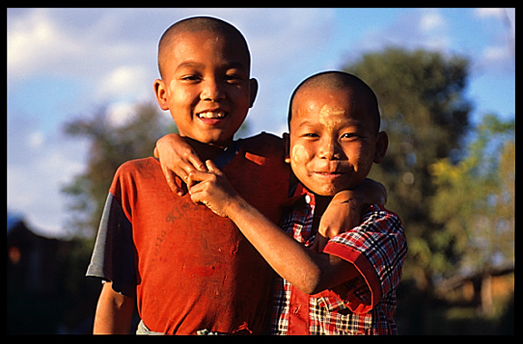 Two Burmese boys with thanakha paste on their face.