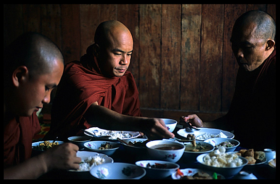 Monks having lunch in monastery ni Nanthe village near Nyaungshwe.