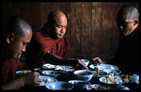 Monks having lunch in monastery ni Nanthe village near Nyaungshwe.