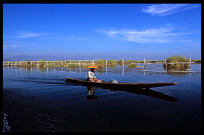 A Burmese woman in a canoe on Inle Lake.