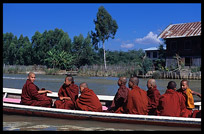 Young monks in motorboat on Nankand Canal connecting Nyaungshwe with Inle Lake.