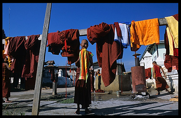 Monks washing and showering at  Shwe Yaunghwe Kyaung, an 18th-century wooden monastery near Inle Lake.