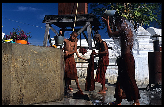 Monks washing and showering at  Shwe Yaunghwe Kyaung, an 18th-century wooden monastery near Inle Lake.