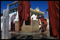 Monks washing and showering at  Shwe Yaunghwe Kyaung, an 18th-century wooden monastery near Inle Lake.
