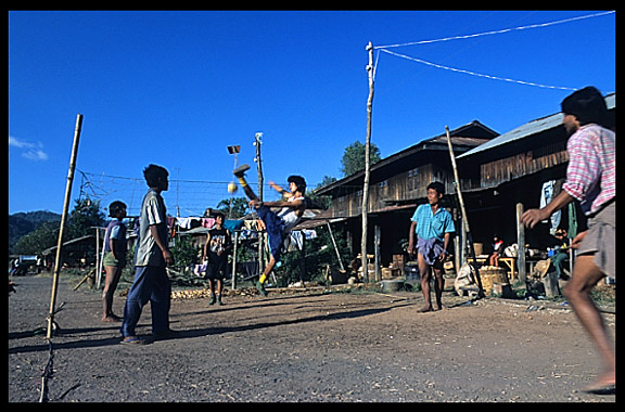 Playing chinlon on the Railway station in the village of Myin Saing Gone on the Shan Plateau near Kalaw.