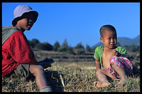 Two Burmese children sitting in the field on the Shan Plateau near Kalaw.